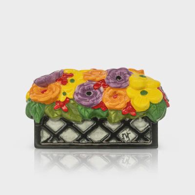 Nora Fleming Love Blooms Here floral basket interchangeable mini against a neutral studio background
