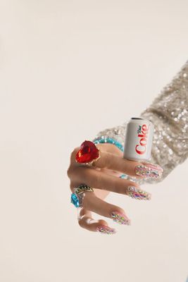 Nora Fleming Diet Coke can decorative mini collectible displayed in a lifestyle setting