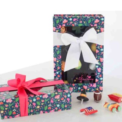 Floral keepsake box by Nora Fleming with magnetic closure, displayed in a lifestyle setting, designed to hold six minis