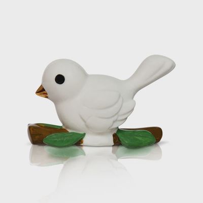 Nora Fleming Bestie Bird mini collectible in the shape of a white friendship dove with painted details, shown against a neutral background