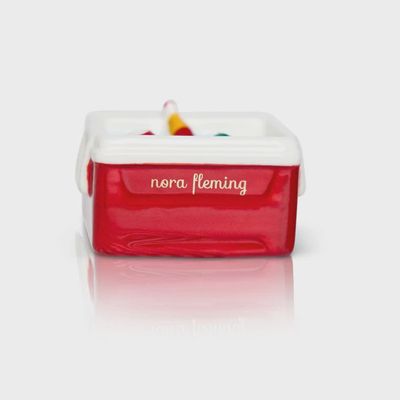 White Nora Fleming Ice Cold mini cooler with handle displayed against a neutral background in studio lighting