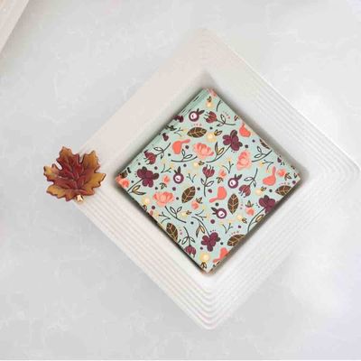 Nora Fleming Pinstripes napkin and candy holder, 8.25 inches square, displayed in a table setting with striped design detail