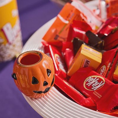 Nora Fleming Boo Bucket mini jack-o'-lantern Halloween decoration displayed in a styled home setting