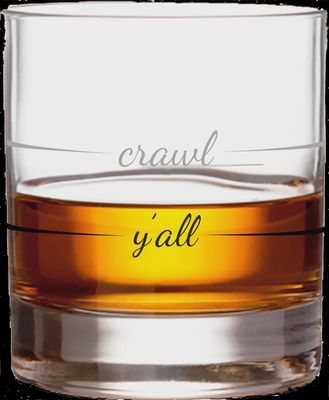 Clear rocks glass whiskey tumbler with textured crawl pattern design on white background, studio shot