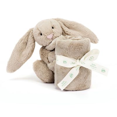 Cream-colored plush Jellycat Bashful bunny soother with attached pacifier holder, displayed on white background
