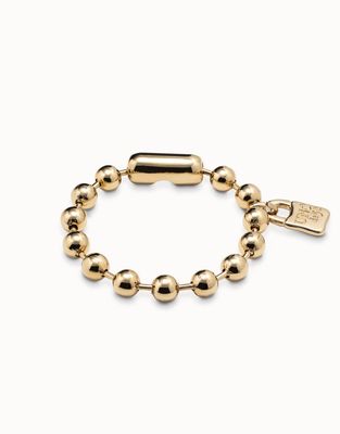Silver-plated handcrafted snowflake bracelet by Uno de 50 against a neutral background, showcasing detailed metalwork design