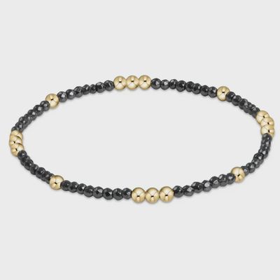 ENEWTON Worthy Pattern Bracelet in 2mm faceted hematite beads with gold-filled accents, displayed on a neutral background