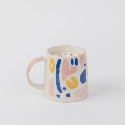 Bridgewater Sweet Grace soy-blend candle in glass jar next to a reusable ceramic mug, studio product shot on white background