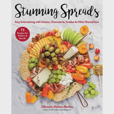 Stunning Spreads Appetizer &amp; Cocktail Cookbook by Simon &amp; Schuster displayed against a white background