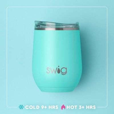 Swig Life Spellbound glow-in-the-dark insulated stemless wine cup in 12oz size displayed in a lifestyle setting