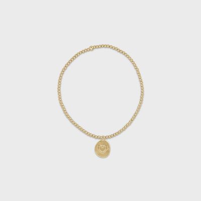 Gold-plated beaded bracelet with small Inspire Love disc charm in studio setting, isolated on white background