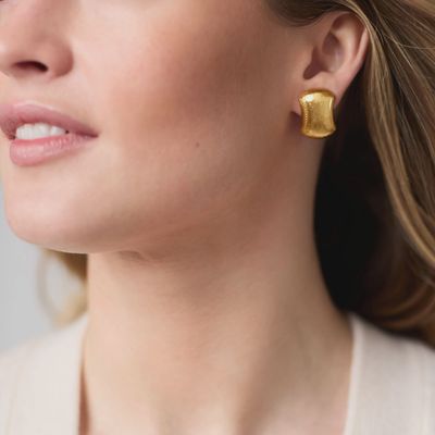 Julie Vos Cannes clip-on earring in 24K gold plate displayed in a lifestyle setting
