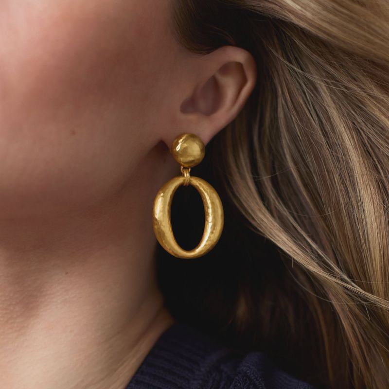 Julie Vos Solara Orbit statement earrings in silver plate with post backs, displayed in a lifestyle setting.