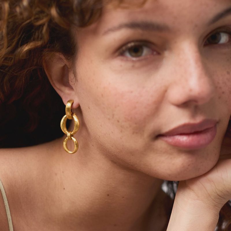 Julie Vos Solara Orbit Post Earrings in 24K gold plate, 1.9 inches, worn in a lifestyle setting