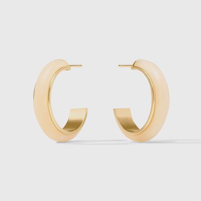 Julie Vos Carnaby hoop earrings in 24K gold plate and acetate, worn in a lifestyle setting