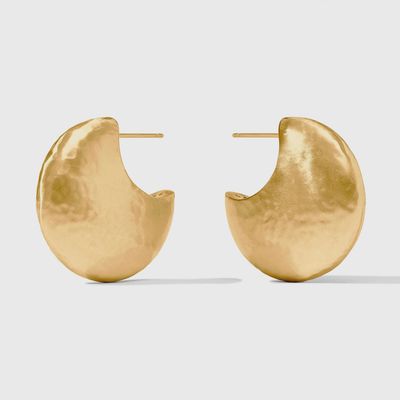 Julie Vos Solara hoop earrings in 24K gold plate, displayed in a lifestyle setting with pierced ear styling