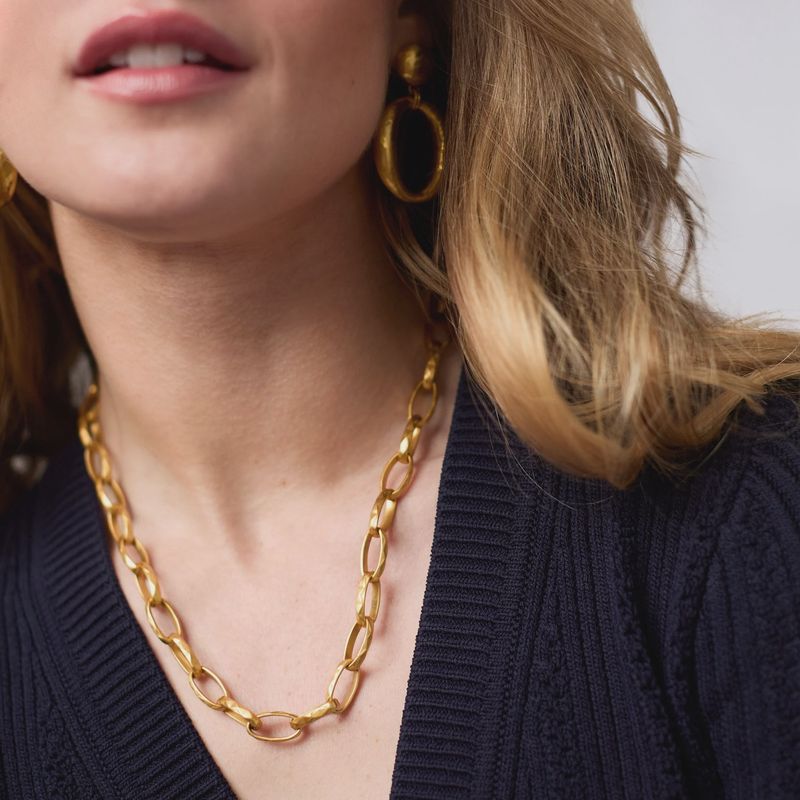 Julie Vos Solara Link necklace in 24K gold plate worn as a layered pendant, showing the linked chain detail and adjustable 20-inch length