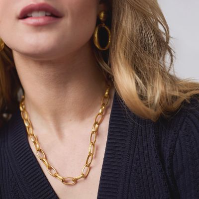 Julie Vos Solara Link necklace in 24K gold plate worn as a layered pendant, showing the linked chain detail and adjustable 20-inch length