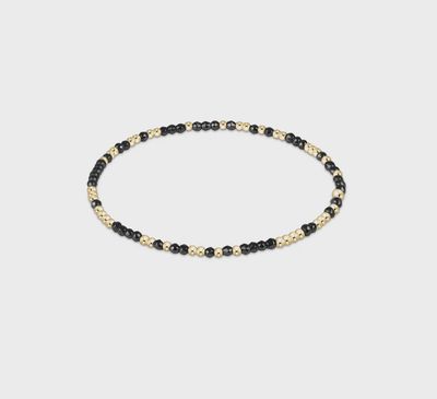 Bright silver Hope Unwritten bracelet with faceted hematite 2mm beads on white background