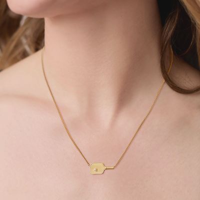 Julie Vos pickleball pendant necklace in 24k gold plate with pearl detail, worn in a lifestyle setting.