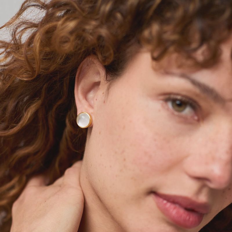 Julie Vos Solara stone stud earrings in 24K gold plate, worn as lifestyle accessory detail