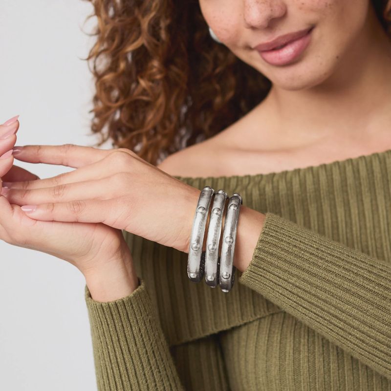 Julie Vos Solara tarnish-free silver plate bangle bracelet worn on wrist in lifestyle setting