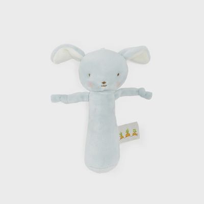 Blue velour puppy baby rattle with chime feature by Bunnies by the Bay, displayed against a white background