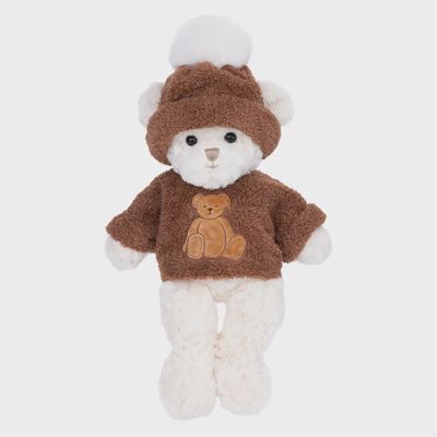 Bukowski Bears River white plush bear, 17 inches tall, wearing a brown knit beanie and matching brown sweater against a neutral studio background