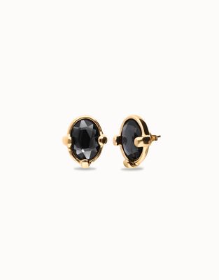 Pair of Uno de 50 Ser Deslumbrante jet black oval crystal stud earrings on a neutral background