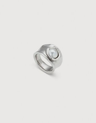 Uno de 50 sterling silver ring featuring a pearl and Swarovski crystals in a studio setting against a neutral background