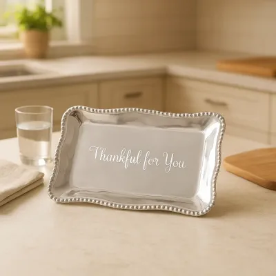Beatriz Ball engraved tray with Thankful for You text displayed on a table with autumn decorations and place settings