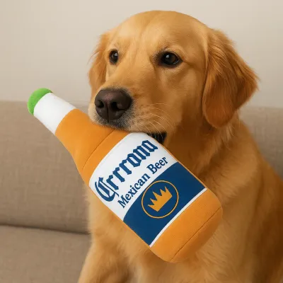 Grrrona beer bottle squeaky dog toy in a lifestyle setting, featuring a tan and brown plush design with printed beer label details