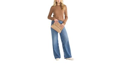 Woman wearing Hammitt Carpenter’s Weave crossbody bag in tan with brushed silver, styled with casual sweater in denim jeans