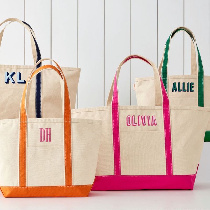 Assorted CB Station personalized canvas tote bags with monograms and embroidered names in multiple colors