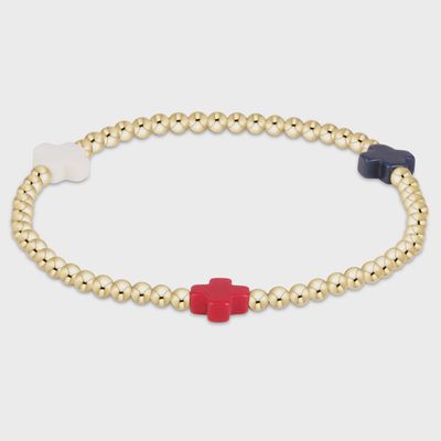 Gold-filled Firecracker bracelet with 3mm cross beads on a neutral studio background