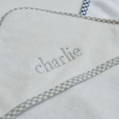 White baby hooded towel with gray trim and embroidered name Charlie, soft personalized terry cloth infant bath towel