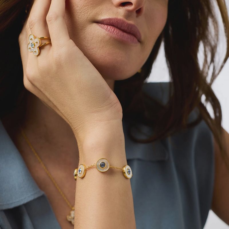 Julie Vos Colette Circle bracelet in 24K gold with cubic zirconia and mother of pearl, styled on wrist in lifestyle setting