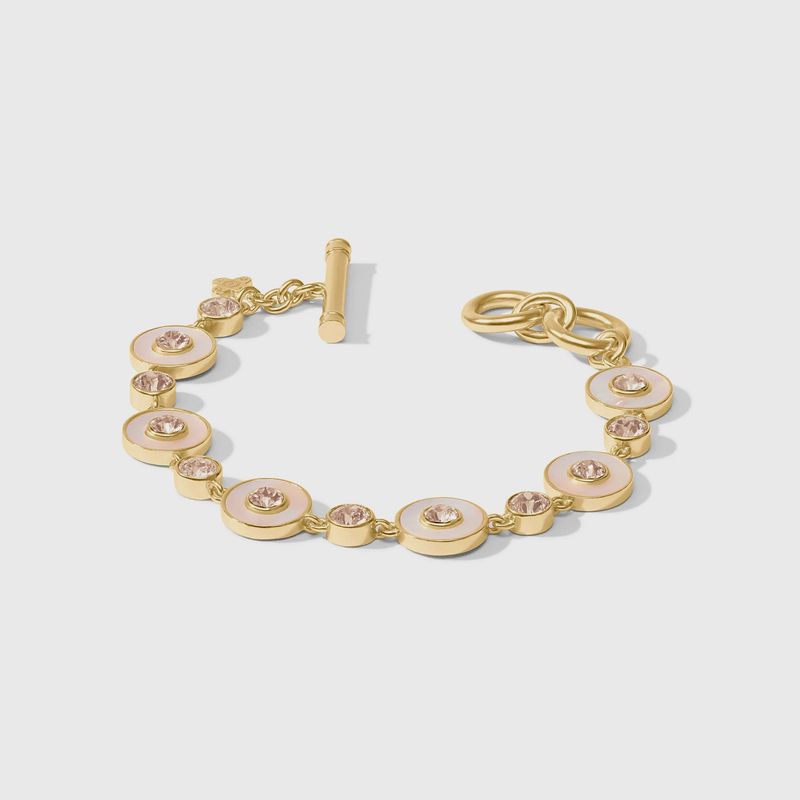 Julie Vos Colette tennis bracelet in 24K gold with cubic zirconia and mother of pearl accents worn on wrist