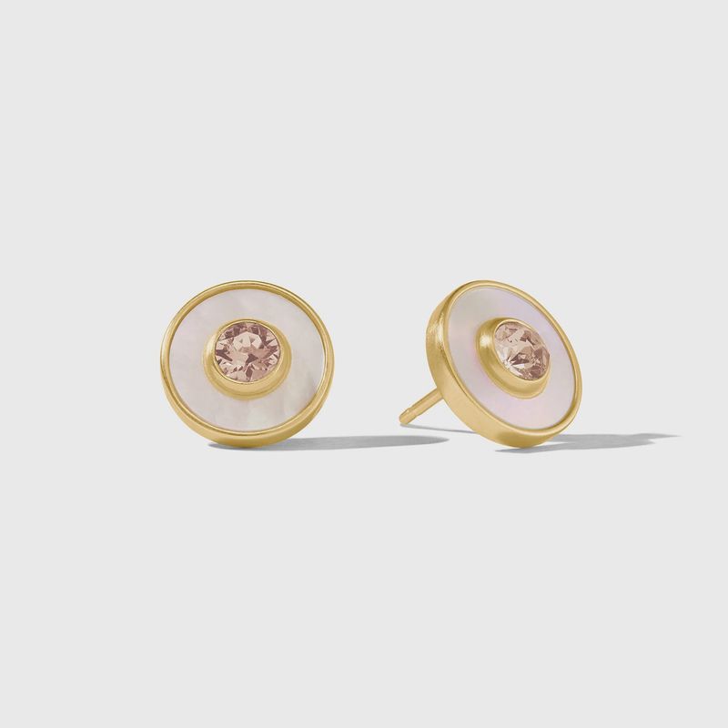 Julie Vos Colette circle stud earrings in 24K gold with cubic zirconia and mother of pearl accents, worn in a lifestyle setting