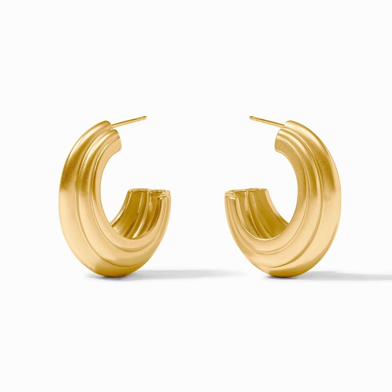 Julie Vos Portofino statement hoop earrings in 24K gold plate worn in a lifestyle setting