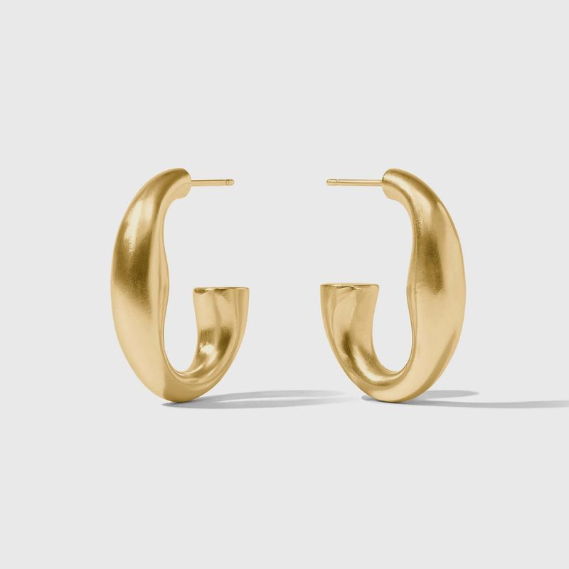 Julie Vos Laguna hoop earrings in 24K gold plate with post back closure, displayed in a lifestyle setting