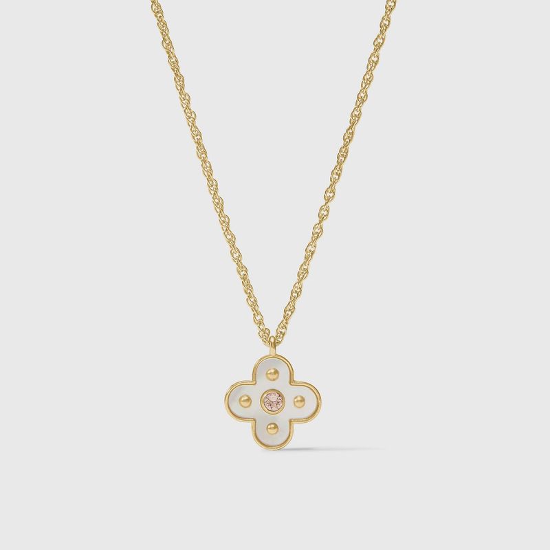 Julie Vos Colette pendant necklace in 24K gold with cubic zirconia and mother of pearl, worn in a lifestyle setting.