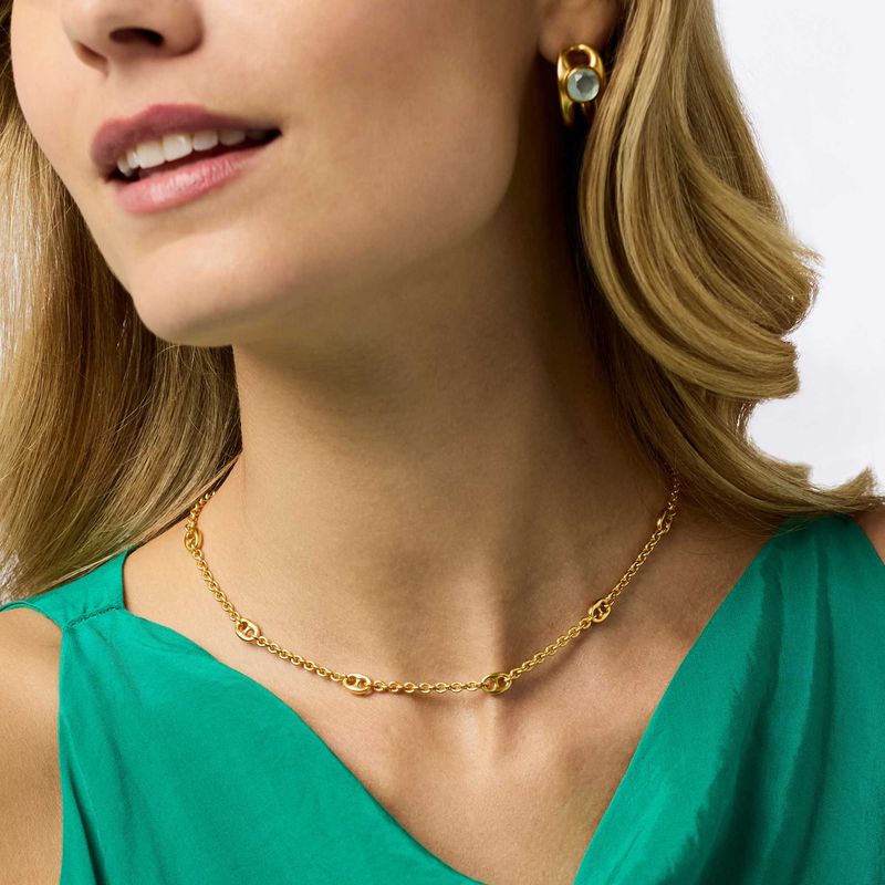 Julie Vos Laguna Delicate Station necklace in 24K gold plate, adjustable length, worn in a lifestyle setting