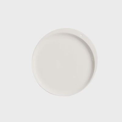 Nora Fleming Celebration Circle stoneware dinner plate, 11.5 inches, shown on neutral background in studio setting.