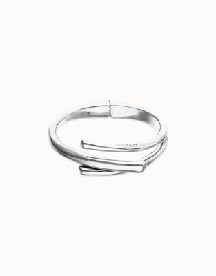 Uno de 50 Roots bangle bracelet featuring three intertwined organic shapes in polished metal, displayed against a neutral background