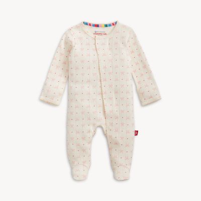 Magnetic Me Heart &amp; Bow Pointelle organic cotton magnetic footie in studio setting, featuring decorative heart and bow design on cream pointelle fabric