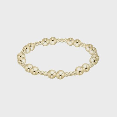 Gold ENEWTON Together bracelet with 6mm beads on white studio background