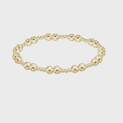 Gold 5mm stackable bracelet from ENEWTON's Together collection displayed on a neutral studio background