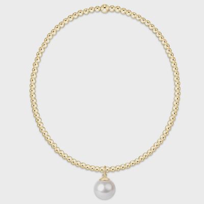 Gold-filled 2mm beaded bracelet with 8mm pearl charm on white background, studio shot