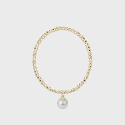 Gold beaded bracelet with 3mm spheres and 10mm white pearl charm displayed on white background